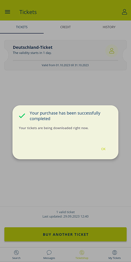 Confirmation screen in the MVV app showing successful Deutschland-Ticket purchase and ticket download in progress.